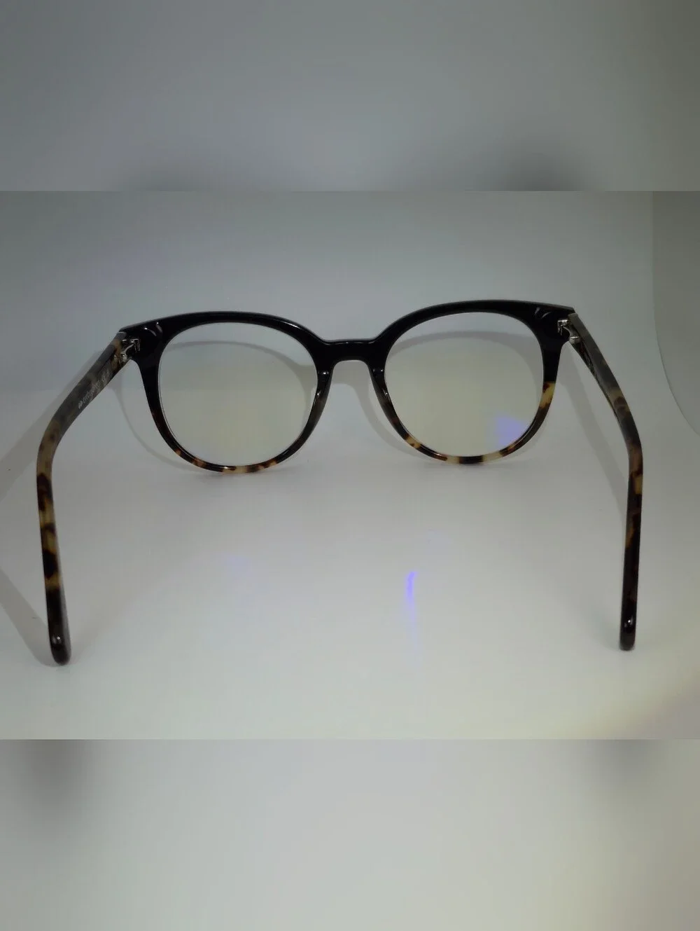 Rialto. Classic Round Black Upper, Animal Print Lower And Temples.